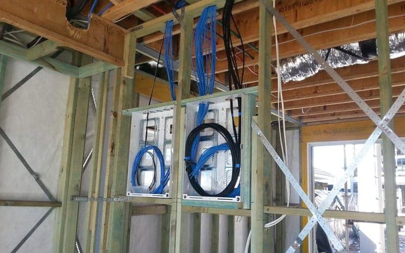 Cat6 cabling roughed in to a timber-framed wall during construction, ready for the wall plates