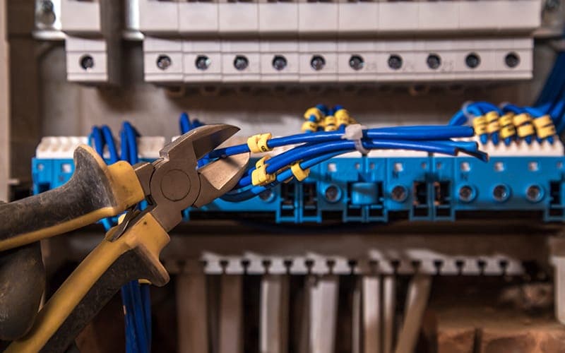 Cat6 data cables being trimmed and terminated into a distribution block
