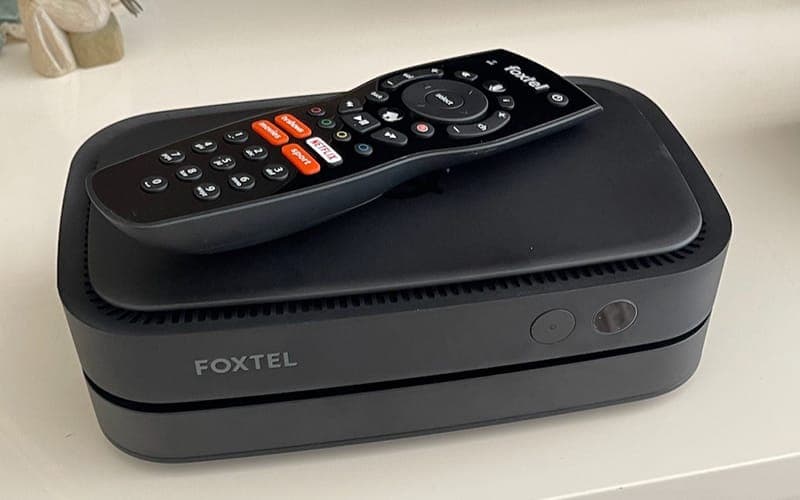 Foxtel iQ set-top box with its remote on top