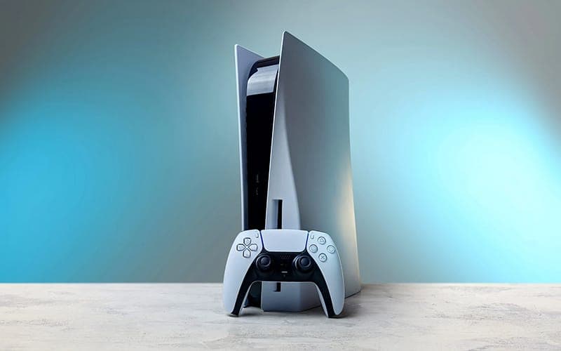 PlayStation 5 console standing beside a DualSense controller