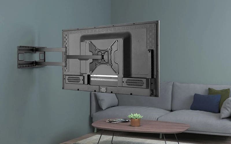 Rear view of a TV on a full-motion articulating wall bracket with the arm extended